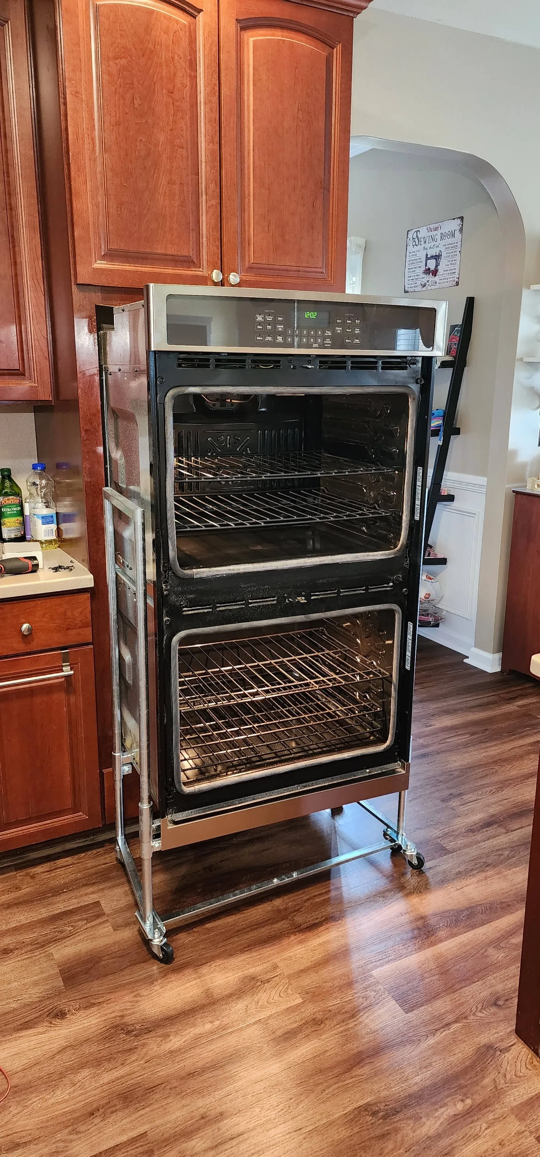 Oven pulled out of cabinet ready for repair