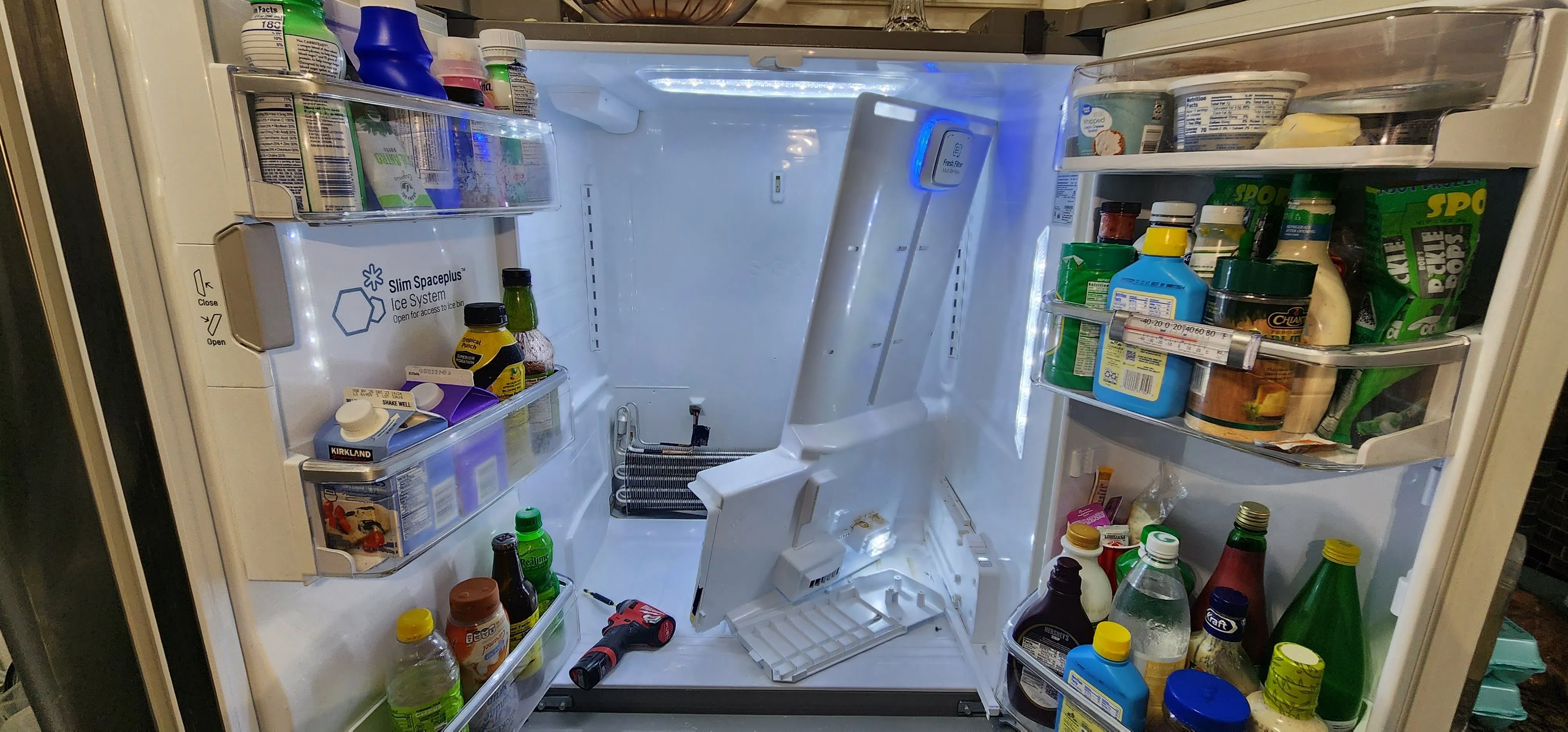 Open refrigerator compartment during a cooling system repair